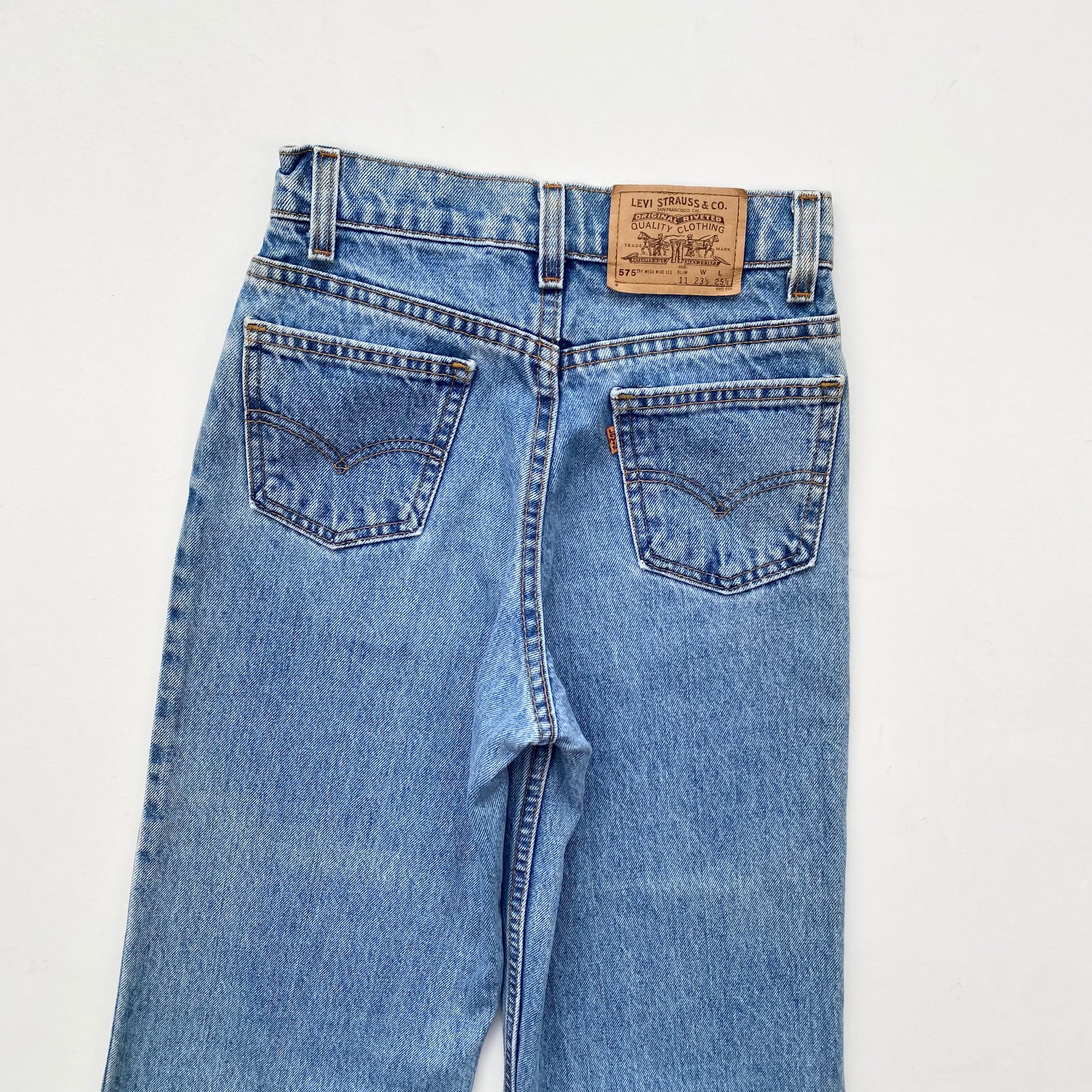 Orange levi's jeans deals